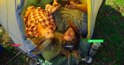 Couple camping with social media integration outdoors