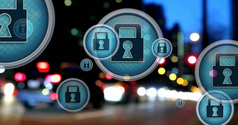 Cybersecurity Lock Icons Over Urban Night Traffic