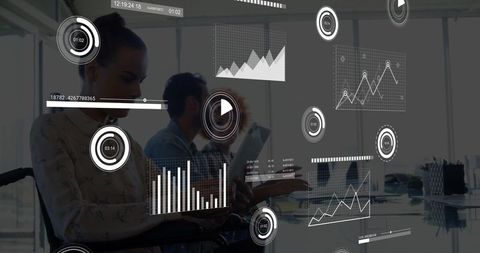 Business Professionals Discussing Data with Holographic Charts in Modern Office