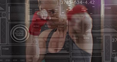 Mid adult female boxer punching with red gloves and digital hud overlay for fitness tech