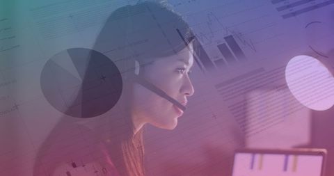 Analyzing Data with Focused Young Businesswoman in Office Setting