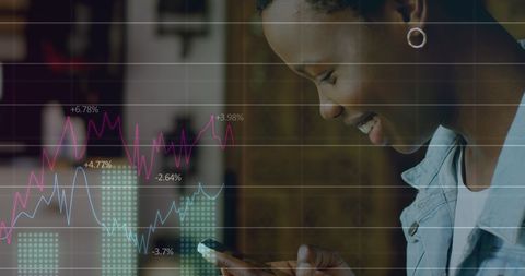 African American Woman Engaging with Dynamic Financial Data on Smartphone