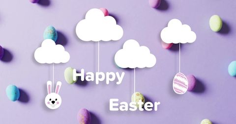 Colorful easter eggs and clouds on purple background