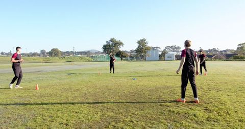 Youth Soccer Team Practicing Drills on Sunny Morning