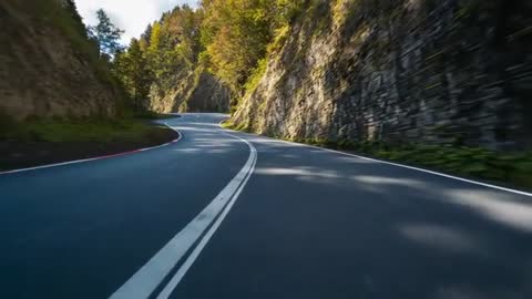 Scenic Drive Through Winding Mountain Pass Captured with Smooth Movement