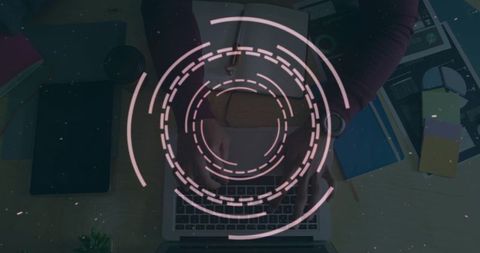 Digital interface overlay on person typing at desk