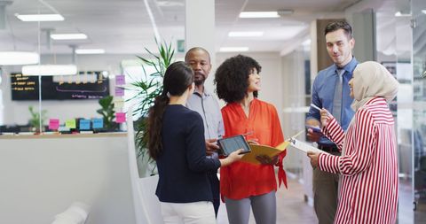 Diverse Team Discussing in Modern Office Environment - Download Free Stock Images Pikwizard.com