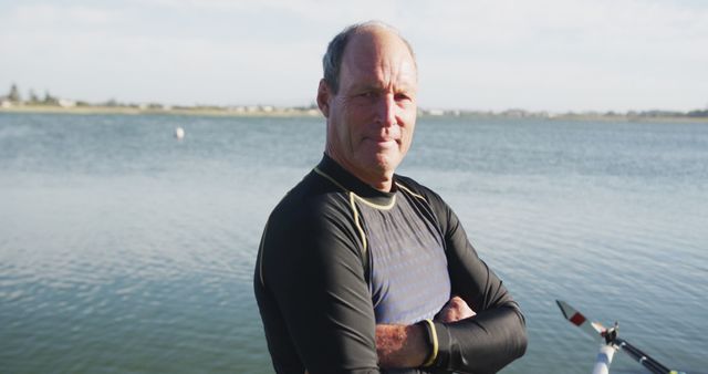 Confident Middle-Aged Man Standing by Lake with Rowing Boat - Download Free Stock Images Pikwizard.com