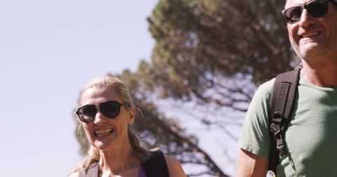 Happy Mature Couple Hiking in Sunny Forest Landscape - Download Free Stock Images Pikwizard.com