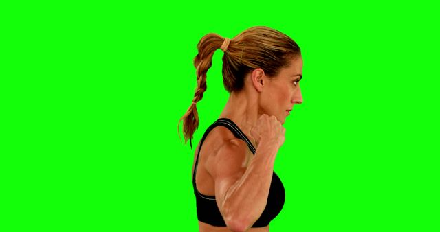 Athletic Woman in Side Profile Preparing for Exercise with Green Screen Background - Download Free Stock Images Pikwizard.com