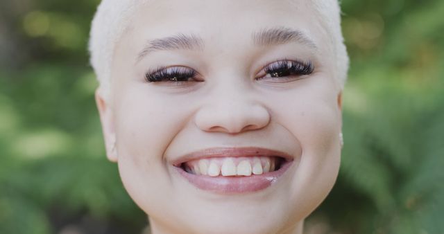 Close-Up of Smiling African American Woman with Blonde Pixie Cut - Download Free Stock Images Pikwizard.com