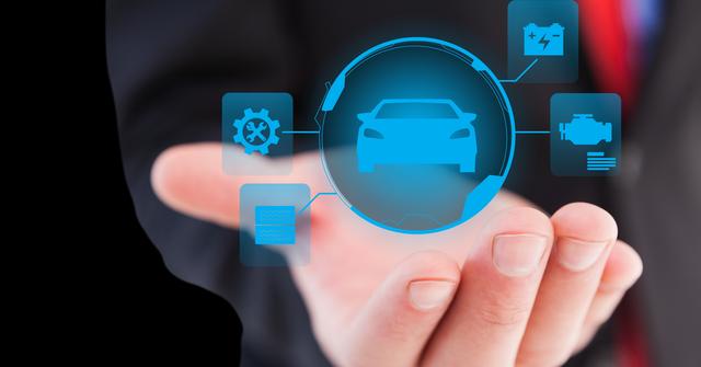 Close-up image showing a hand holding a collection of glowing digital car-related icons including engine, gear, and battery symbols. Useful for illustrating concepts of automotive technology, innovation, future vehicles, holographic interfaces, and car engineering advancements.