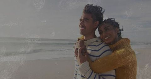 Couple Embracing at Serene Beachfront Enjoying Ocean View