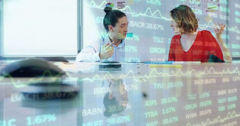 Corporate Professionals Reviewing Stock Market Data in Office