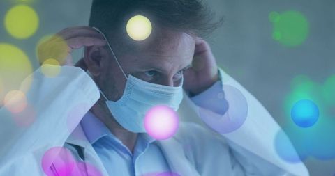 Doctor Masking Up with Abstract Colorful Dots Overlay