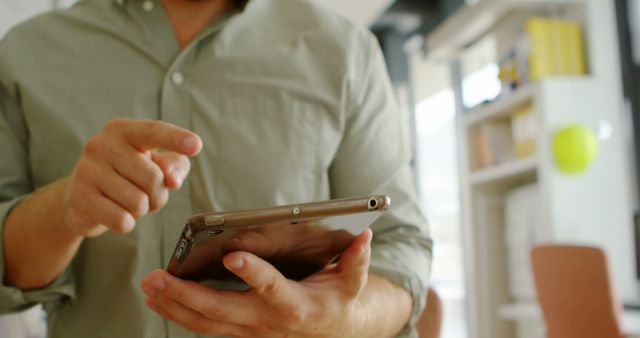 Person using tablet in modern office, close-up on tablet - Download Free Stock Images Pikwizard.com