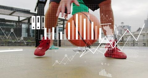 Street basketball player dribbling on urban court with data analytics overlay, red shoes
