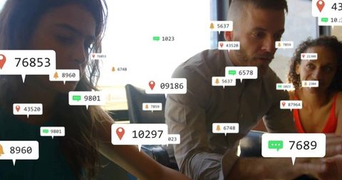 Business Team Analyzing Digital Data and Metrics on Devices in Modern Office