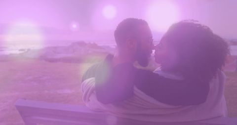 Romantic Diverse Couple on Bench with Dreamy Light Spots