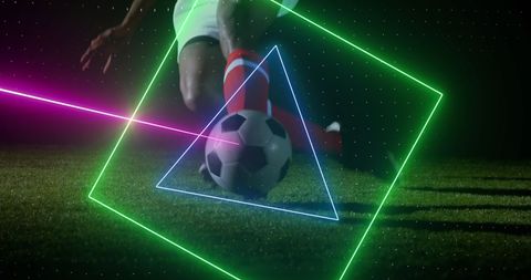 Neon laser effect on football player kicking ball