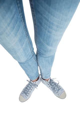 Woman in blue jeans and trainers on transparent background