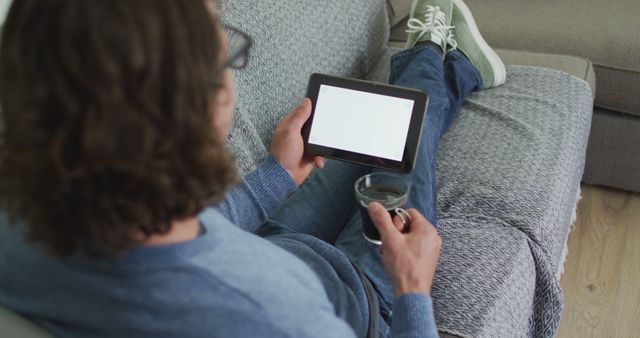 Man Relaxing at Home with Tablet and Coffee - Download Free Stock Images Pikwizard.com