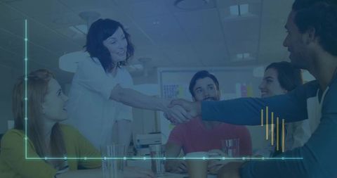 Business team agreement handshake in boardroom