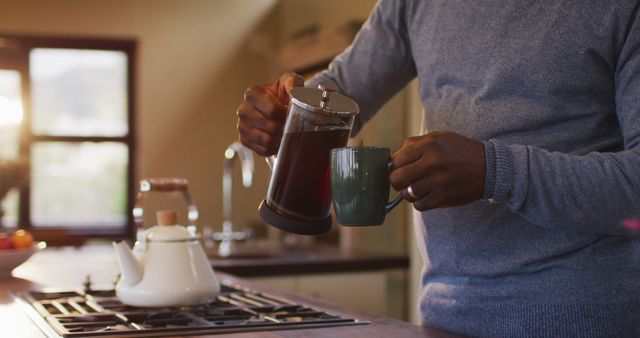 Man Pouring Fresh Coffee from French Press in Modern Kitchen - Download Free Stock Images Pikwizard.com