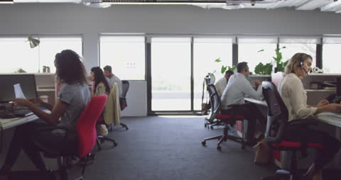 Modern Co-Working Office with Diverse Professionals Engaged in Work