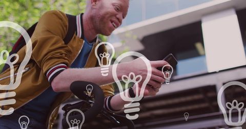 Man Using Smartphone with Digital Interface Light Bulb Icons