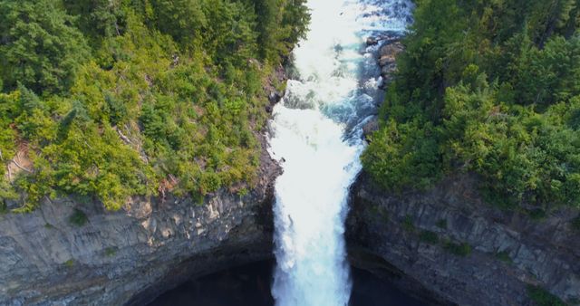 Aerial View of Powerful Waterfall Cascading into Ravine - Download Free Stock Images Pikwizard.com