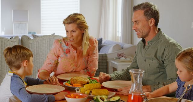 Happy family enjoying healthy dinner together at home - Download Free Stock Images Pikwizard.com