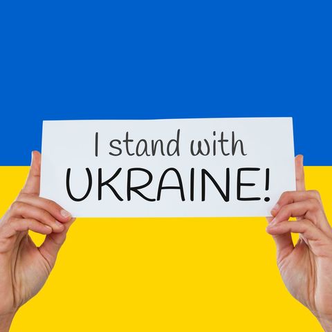 hands holding support ukraine sign against blue and yellow background - Download Free Stock Templates Pikwizard.com