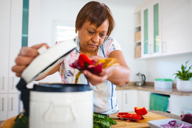 African american senior woman preparing food in kitchen at home. unaltered, retirement lifestyle and cooking.