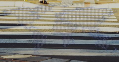 Person Crossing Urban Environment with World Map Overlay