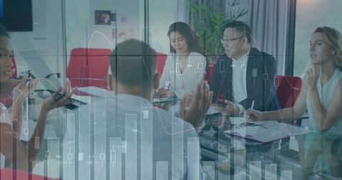 Financial Analysis and Diverse Business Meeting in Modern Office