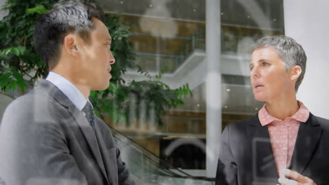 Business Professionals Strategizing with Digital Interface Overlay