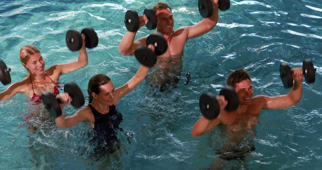 Group Enjoying Aqua Aerobics with Water Weights in Pool - Download Free Stock Images Pikwizard.com