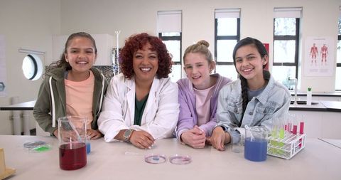 Diverse Science Team Conducting Laboratory Experiment in Classroom