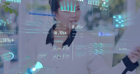 Asian businesswoman interacting with augmented data overlays on glass in modern workspace