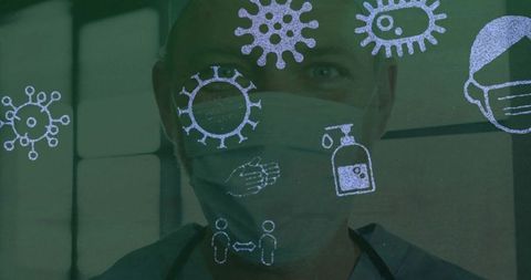 Male clinician wearing mask and scrubs with infection control icons overlay public health