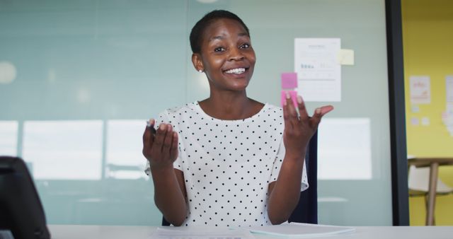 Smiling Businesswoman Holding Blocks During Meeting in Modern Office - Download Free Stock Images Pikwizard.com