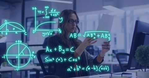 Female student analyzing mathematical formulas on digital screen