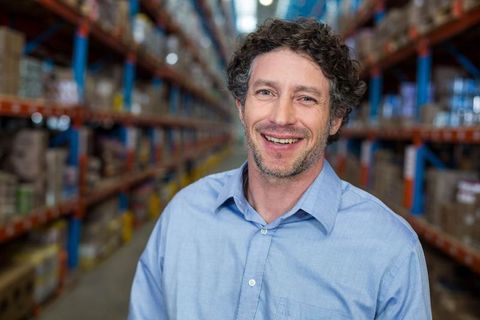 Confident warehouse manager overseeing efficient operations