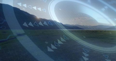 Futuristic HUD Overlay Circles and Chevrons Hovering over Mountain Valley Panorama