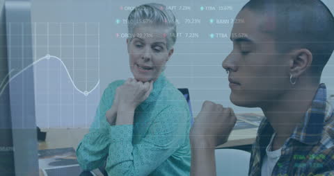 Diverse Coworkers Discussing Stock Market Data in Modern Office