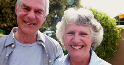 Senior Couple Smiling Joyfully in Garden - Download Free Stock Images Pikwizard.com