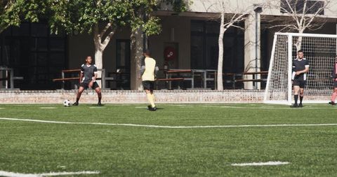 Intense Soccer Match Highlights Players Engaged Outdoors