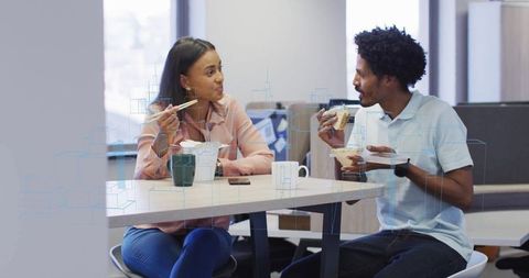 Colleagues Enjoying Lunch in Office Break Room