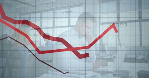 Mid Adult Man Analyzing Financial Data in Open Office